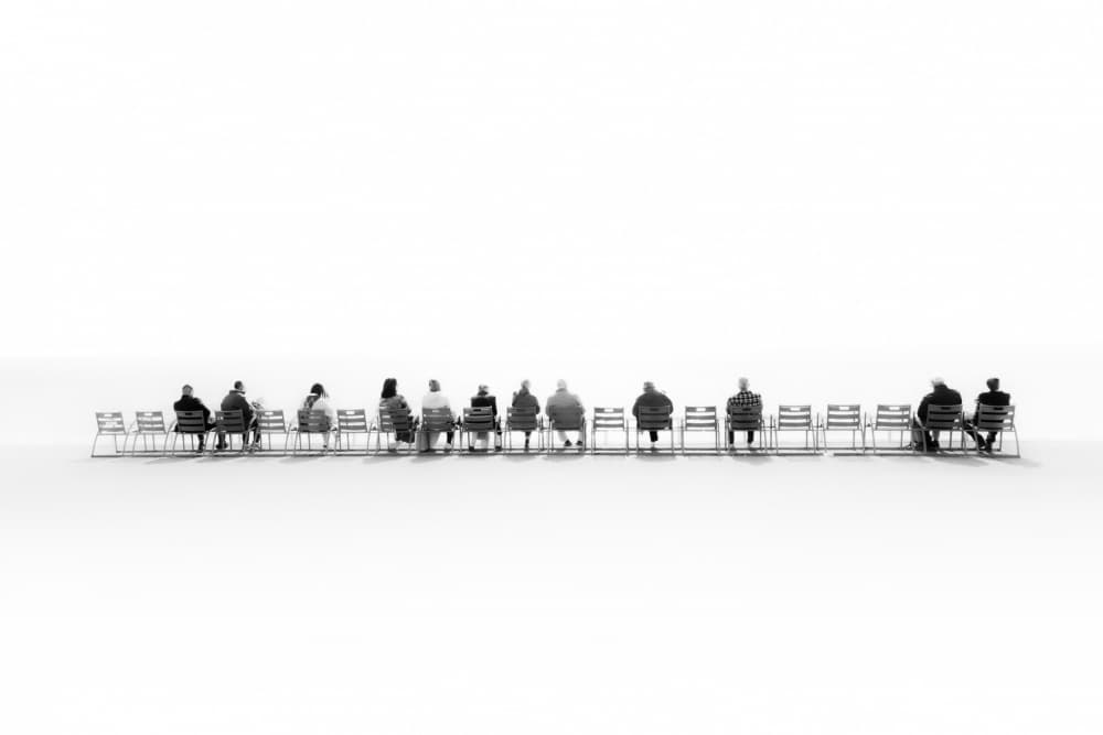 Contemplative Seated Figures by Angelika Vogel — canvas wall art