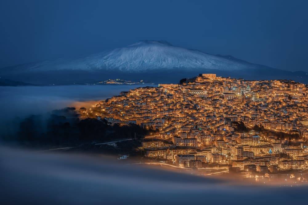 Glowing City Above Mist by Nicholas — canvas wall art