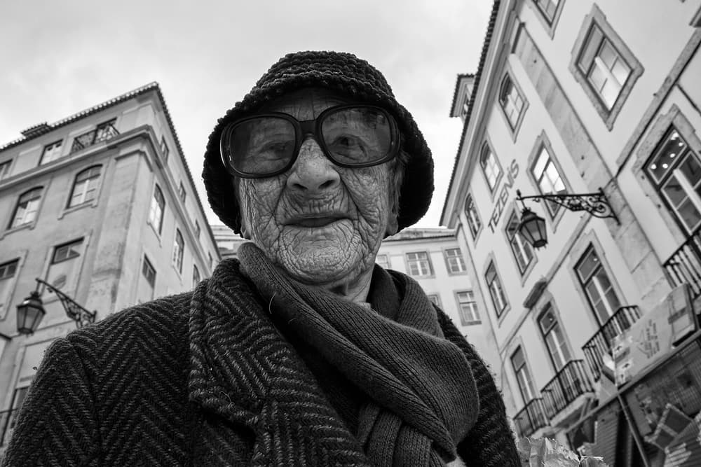Elderly Woman City Gaze by Luis Sarmento — canvas wall art