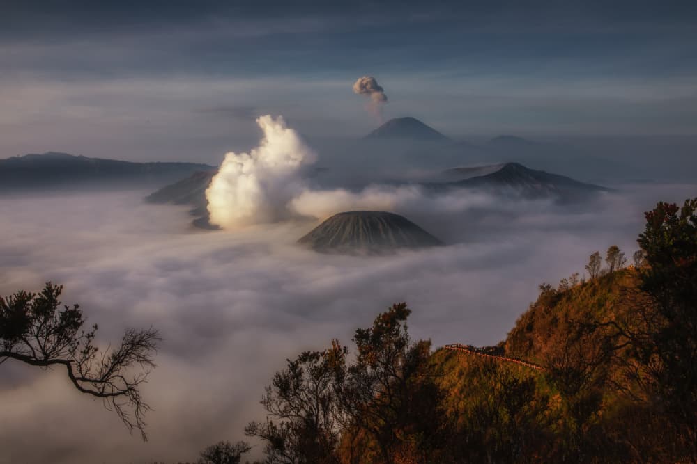 Smoking Volcano Over Fog by UU — canvas wall art