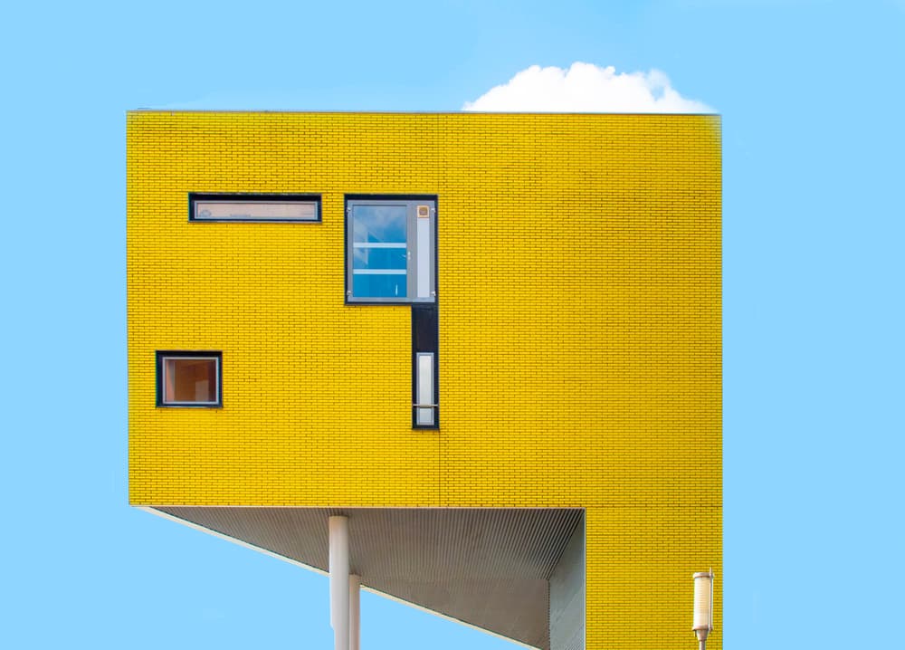 Vibrant Yellow Building by Alida van Zaane — canvas wall art