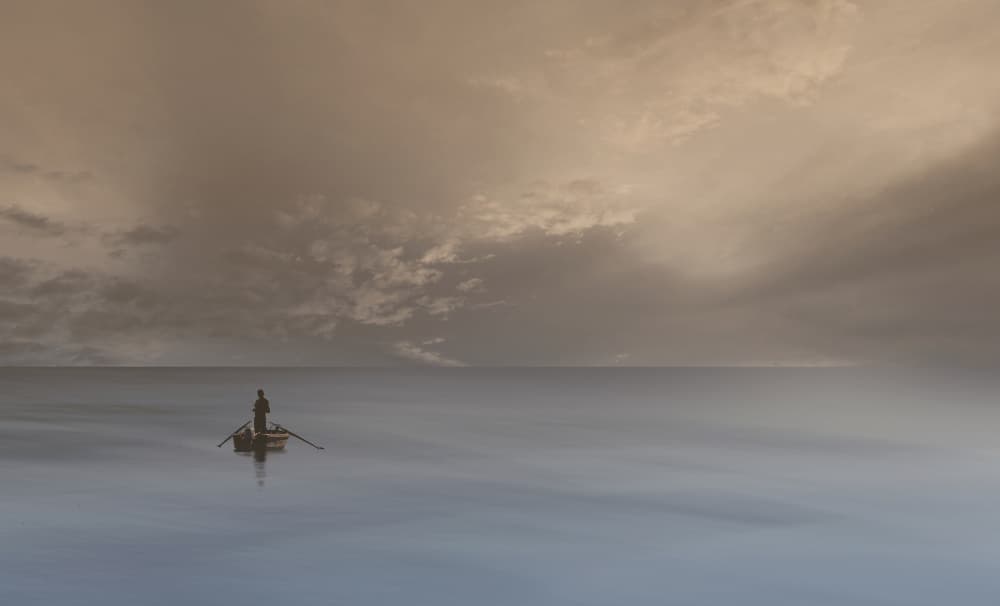 Lone Boatman Calm Waters by Uschi Hermann — canvas wall art