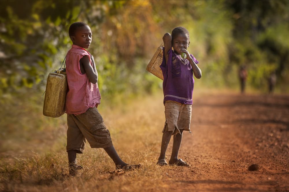 Young Boys Carrying Water by Amnon Eichelberg — canvas wall art