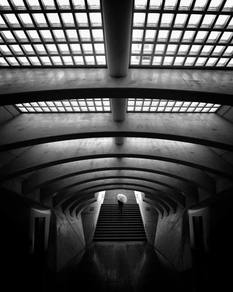 Umbrella Under Arches by Jorge Pimenta — canvas wall art