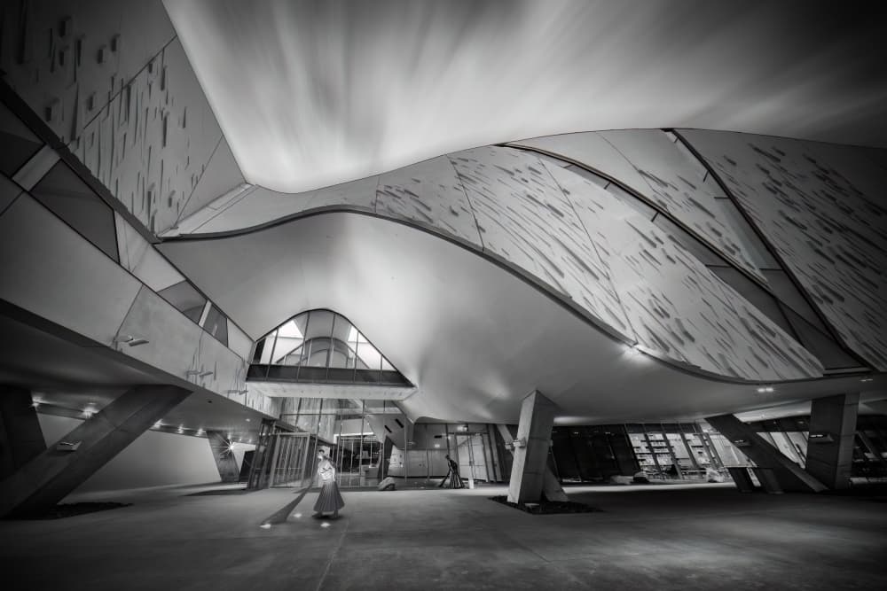 Curved Architecture with Sweeper by Mike He — canvas wall art