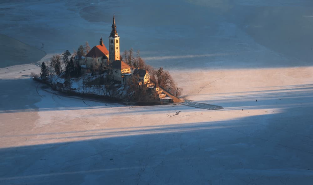 Frozen Lake Bled Island by Ales Krivec — canvas wall art