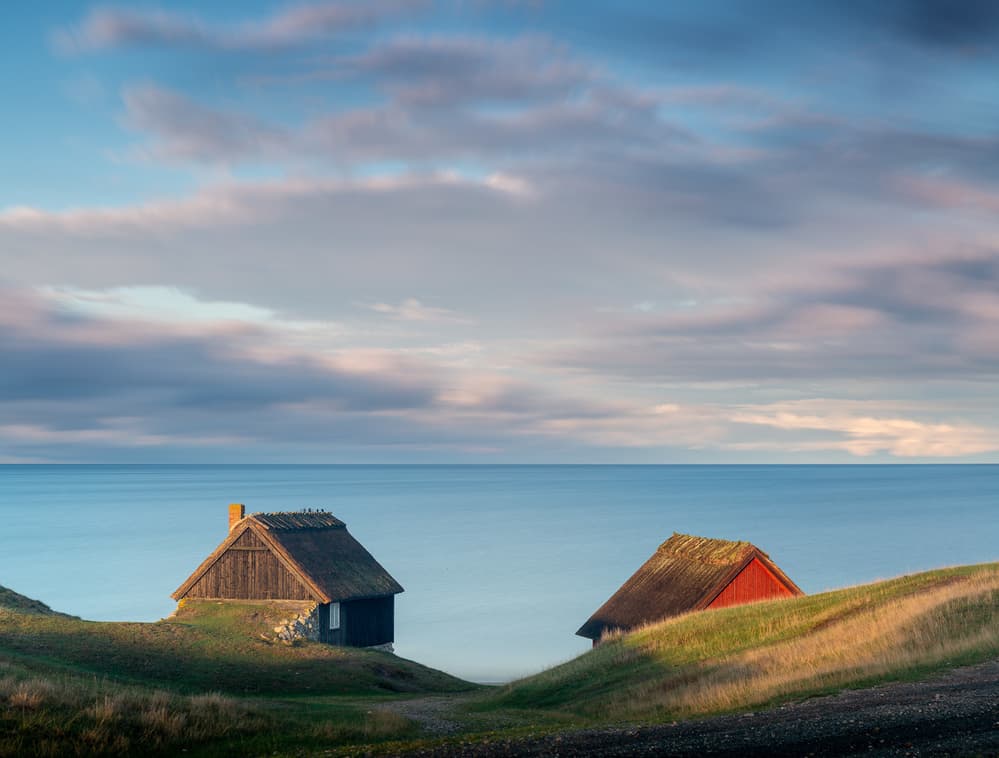 Serene Oceanfront Huts by Andreas Christensen — canvas wall art