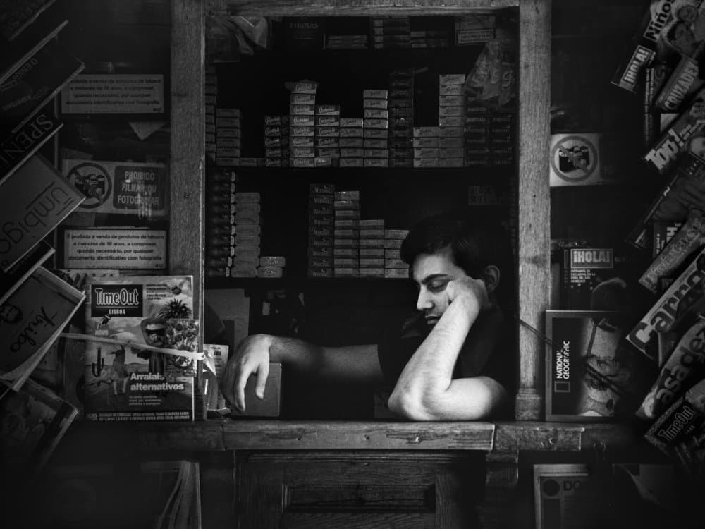 Pensive Man at Counter by Alexander Jikharev — canvas wall art