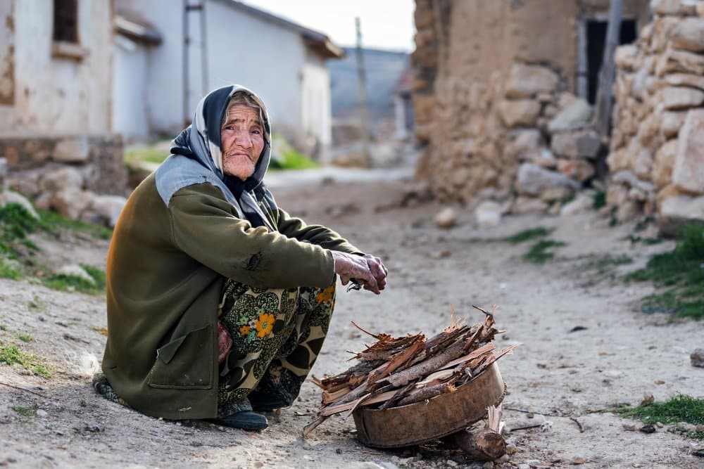 Rural Elder Collecting Firewood by durmusceylan — canvas wall art