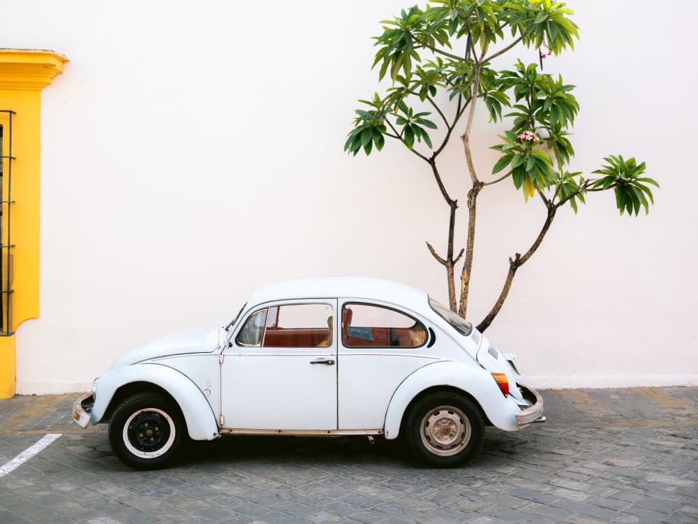 Pastel Volskwagen Beetle in the streets of Oaxaca Mexico by Raisa Zwart — canvas wall art