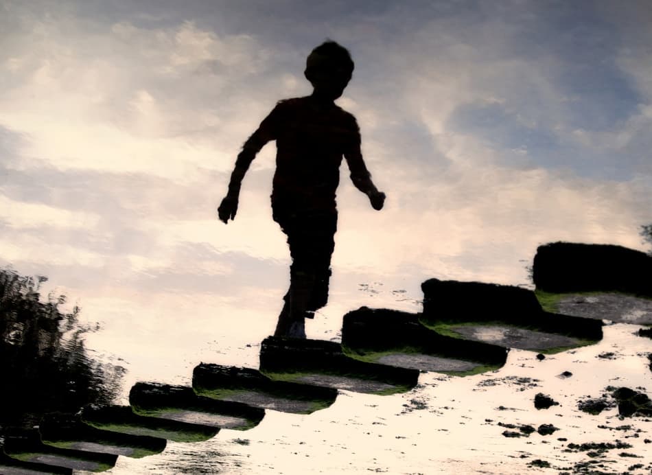 Boy on Stepping Stones by Paul — canvas wall art