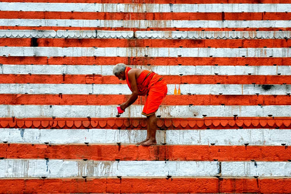 Orange Robe Devotion by Avishek Das — canvas wall art