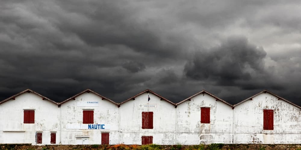 White Buildings Dark Sky by Eric Mattheyses — canvas wall art