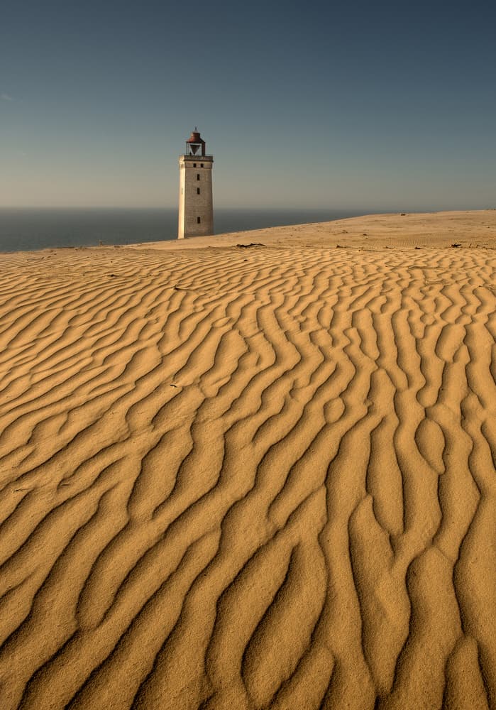 Lighthouse Over Golden Dunes by Claes Thorberntsson — canvas wall art