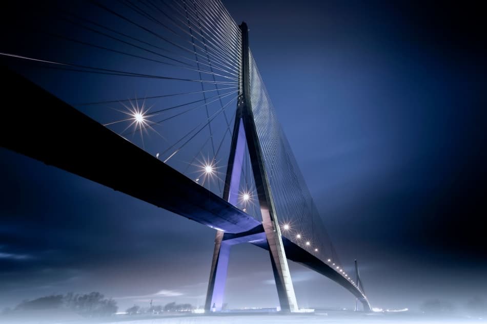 Dramatic Night Bridge by Arnaud MAUPETIT — canvas wall art