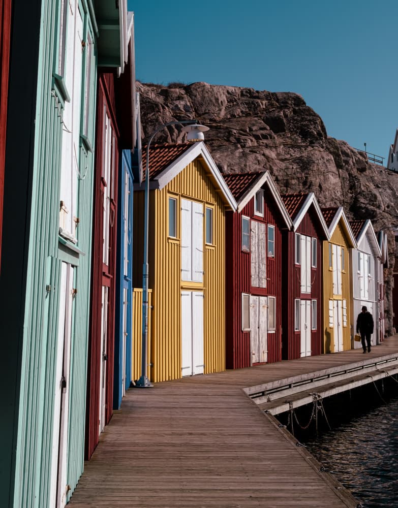 Colorful Nordic Boathouses by Matyáš Rind — canvas wall art