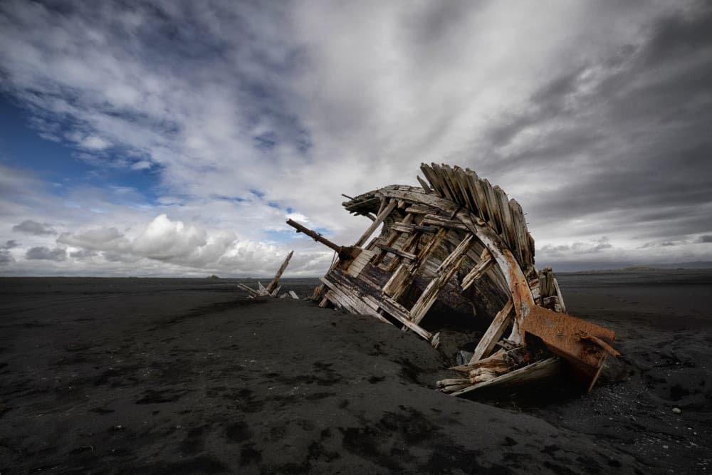 Forgotten Boat on Black Sands by Þorsteinn H. Ingibergsson — canvas wall art