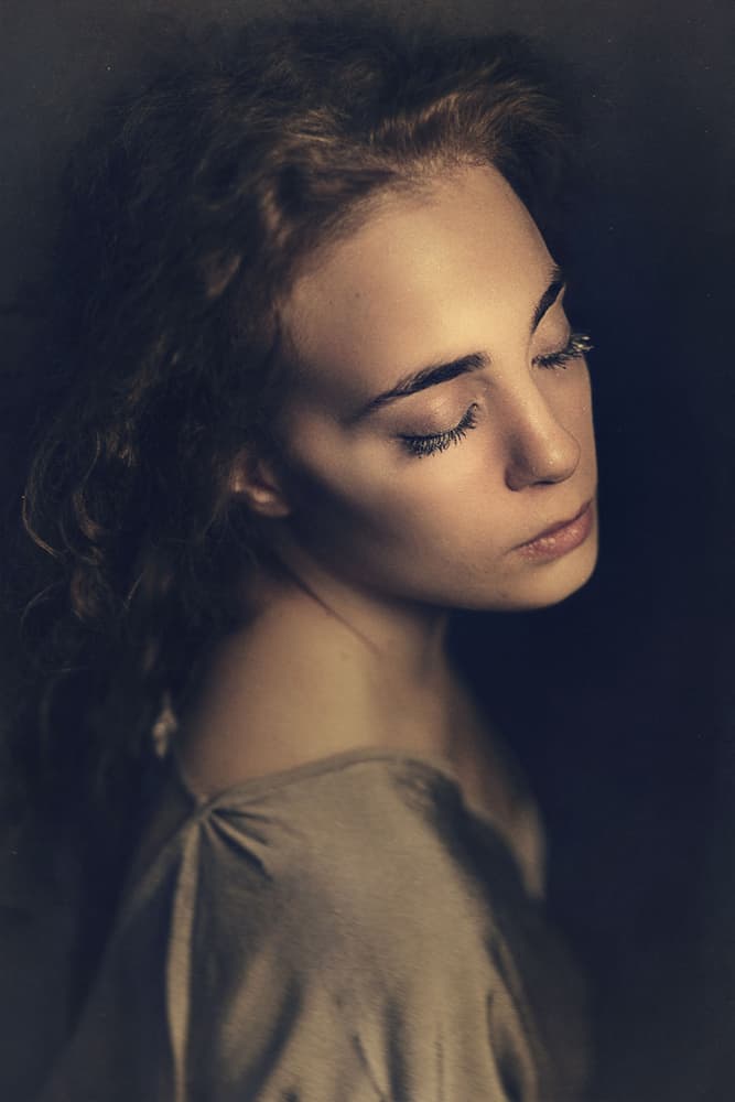 Serene Young Woman Portrait by Antonella Renzulli — canvas wall art