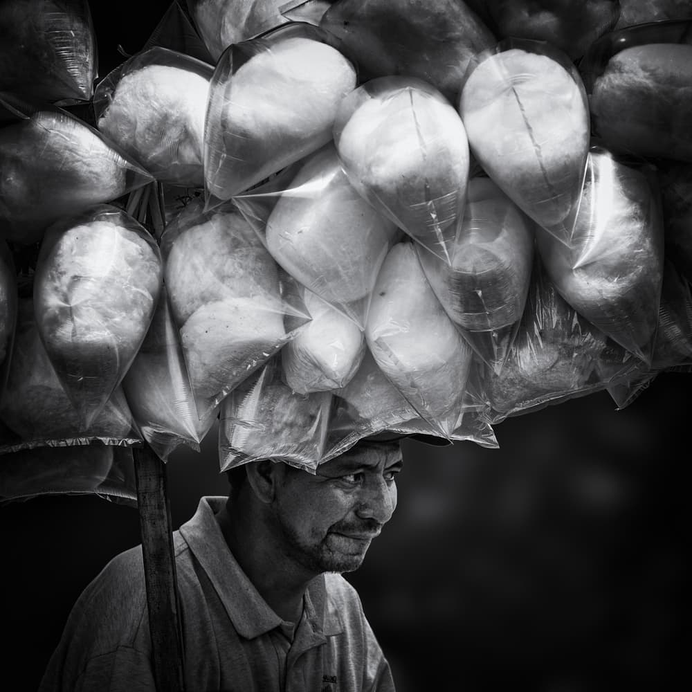 Smiling Street Vendor by Pavol Stranak — canvas wall art