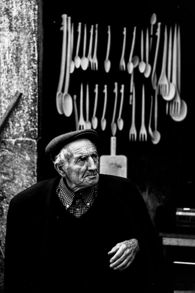 Thoughtful Elder in Shop by Raffaele Maglione — canvas wall art