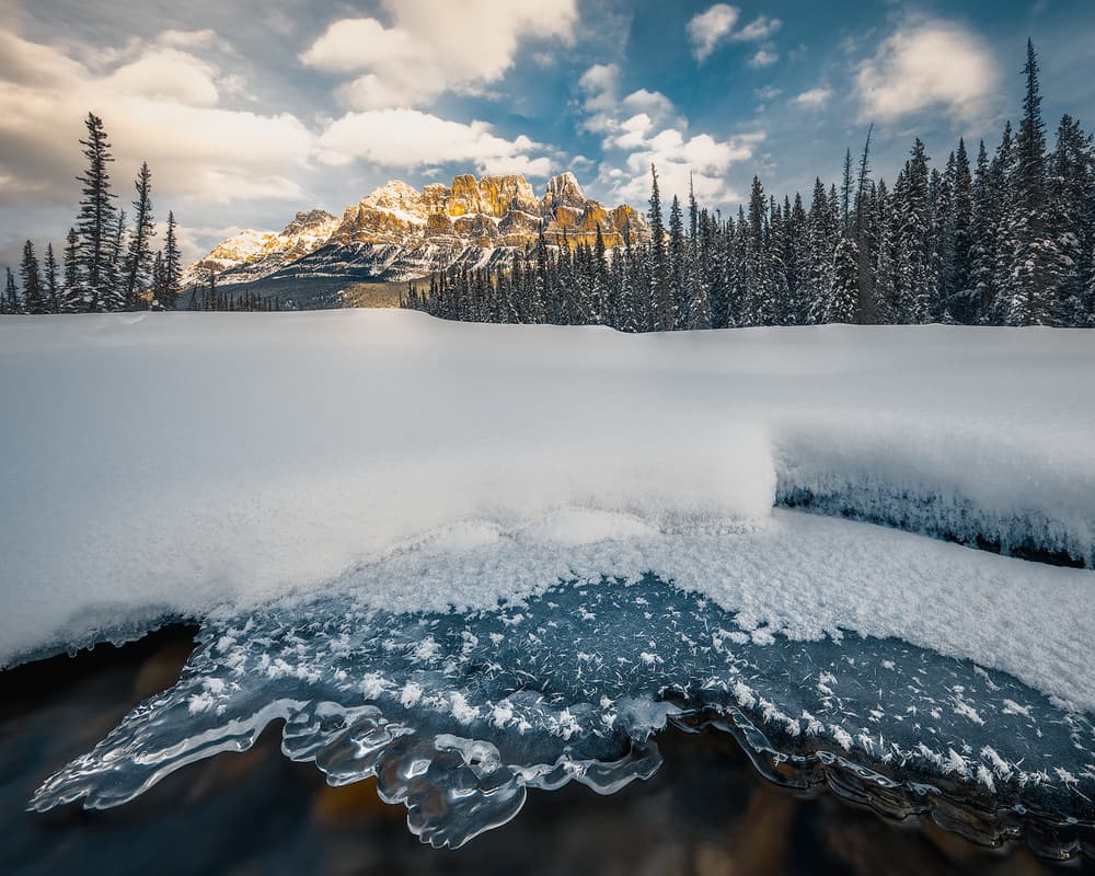 Golden Peaks Winter Stream by Yimei Sun — canvas wall art