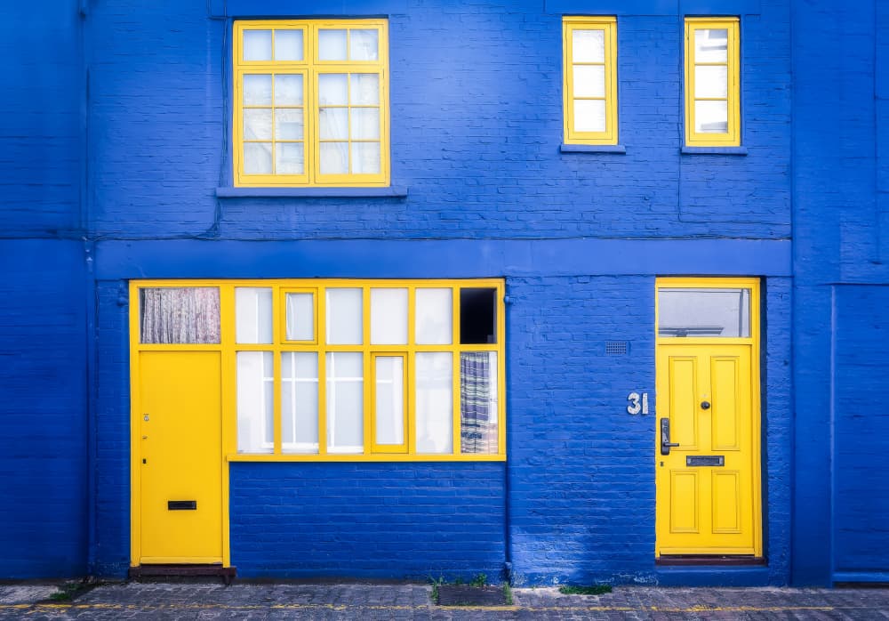Bold Blue Yellow Facade by Juan Luis Seco — canvas wall art