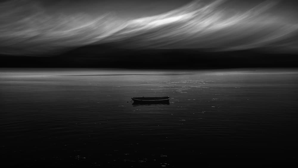 Solitary Boat on Dark Water by Marco Antonio Cobo — canvas wall art