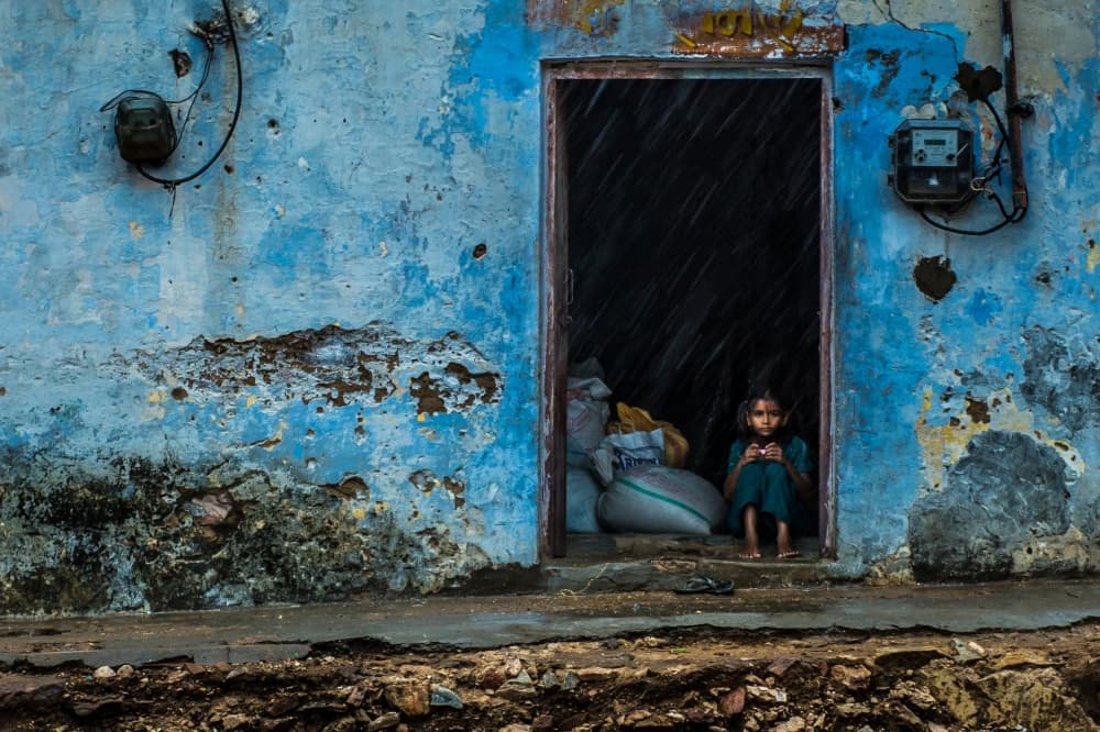 Girl in Blue Doorway by Mohammed Alnaser — canvas wall art
