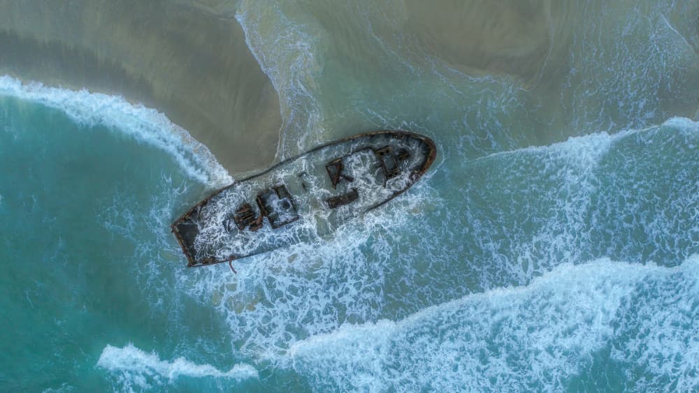 Ocean Shipwreck Aerial by Wisam Hassan — canvas wall art