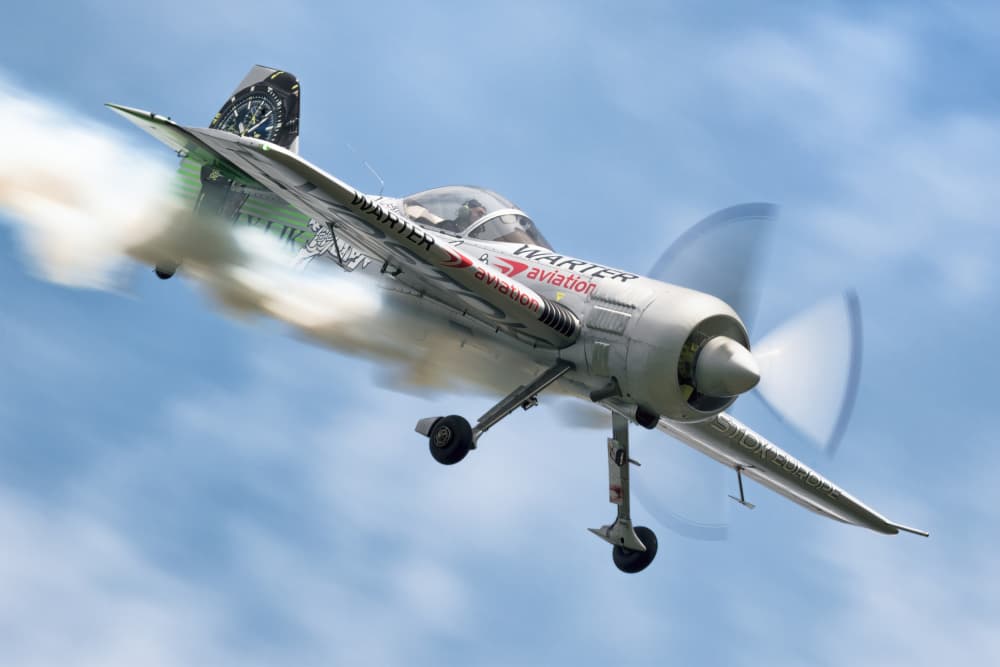 Dynamic Stunt Plane by Piotr Wrobel — canvas wall art