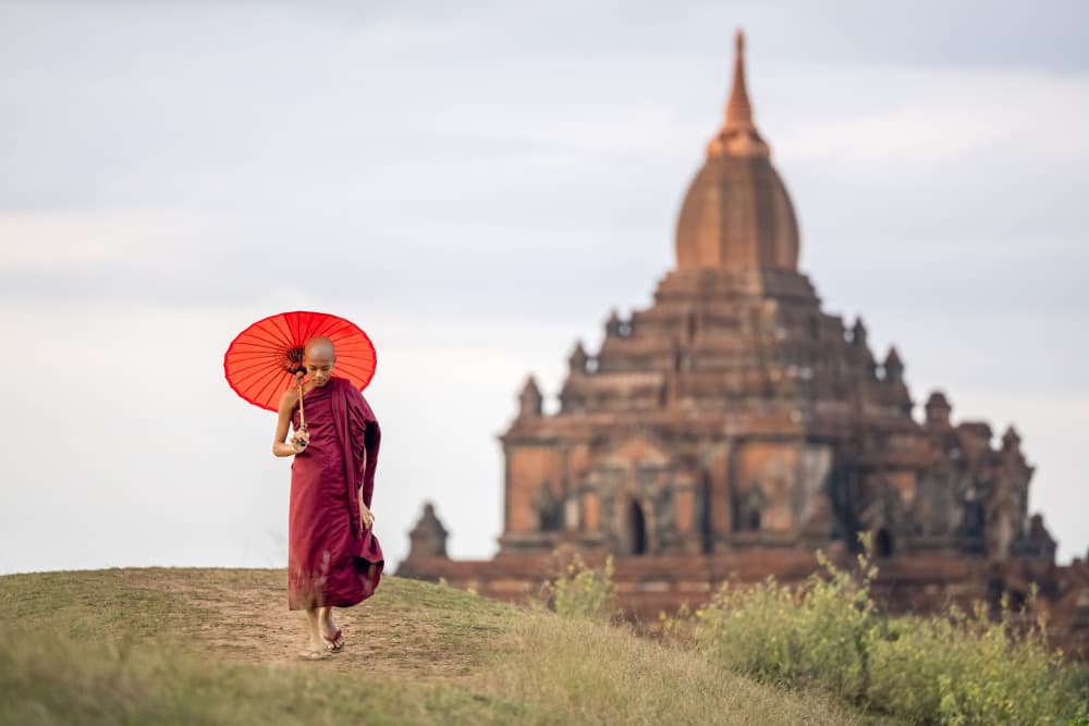 Monk With Red Umbrella by ADIREK M — canvas wall art