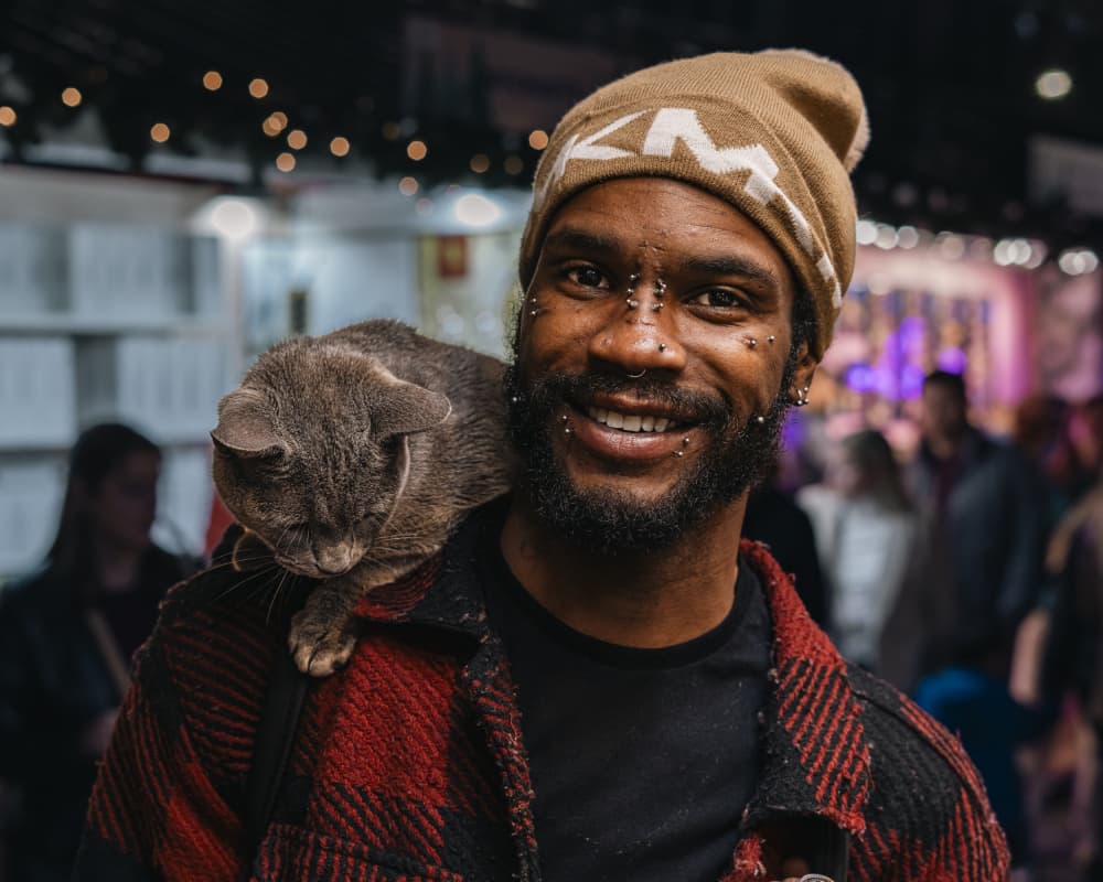 Smiling Man with Cat by Robert Sherman — canvas wall art