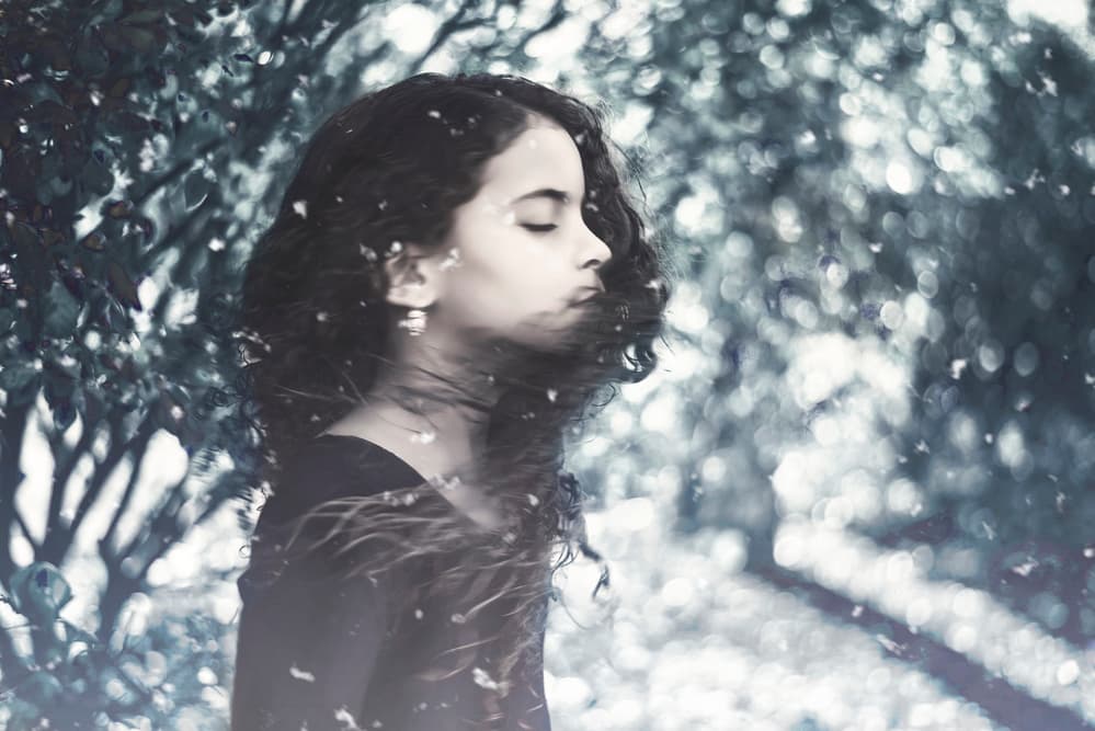 Peaceful Girl Falling Snow by Carmit Rozenzvig — canvas wall art