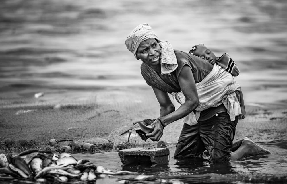 African Mother Fishing by João Coelho — canvas wall art