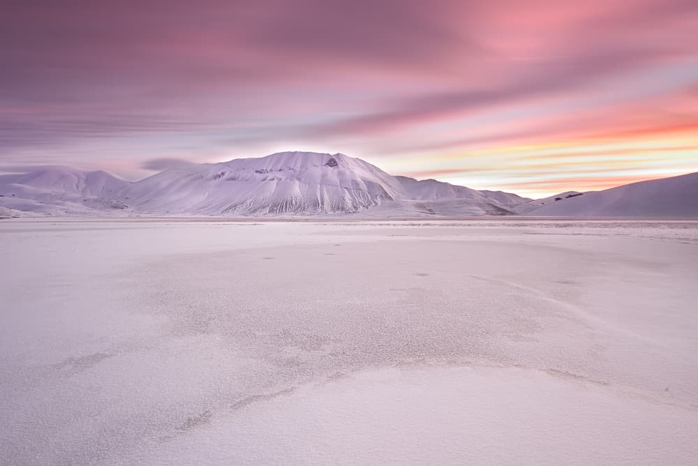 Snowy Mountain Sunset Sky by Roberto Marchegiani — canvas wall art