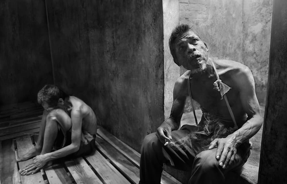 Somber Room Two Men by Sebastian Kisworo — canvas wall art