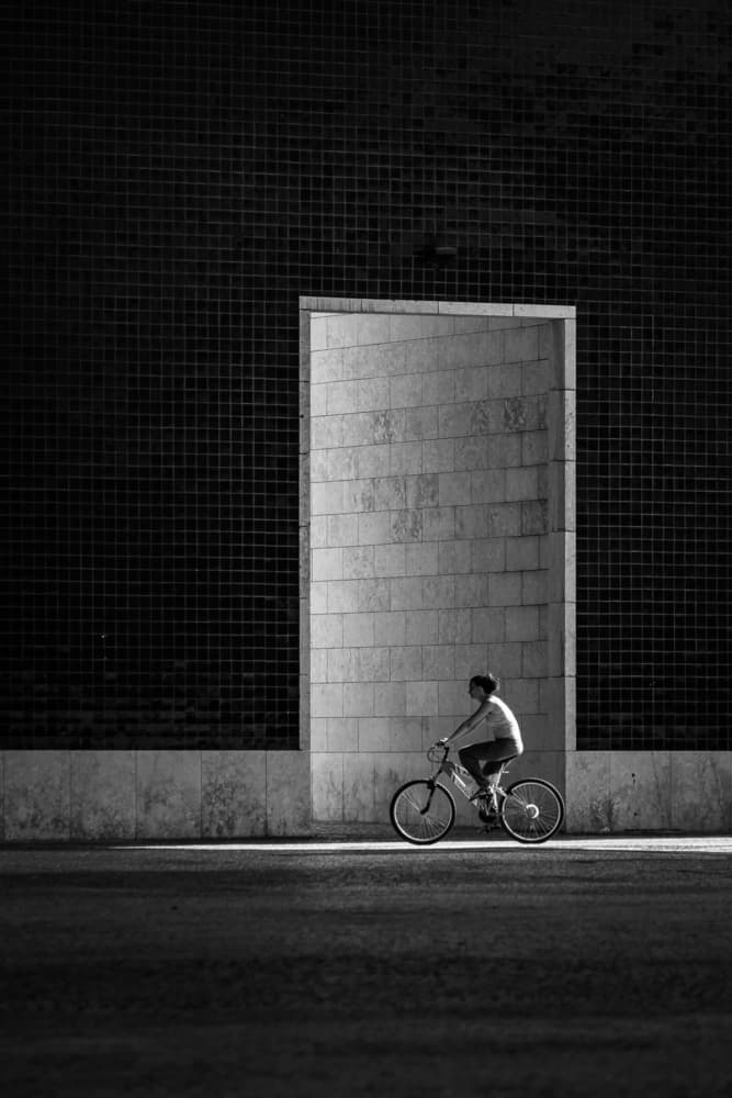 Cyclist Passing Modern Wall by Miguel Silva — canvas wall art