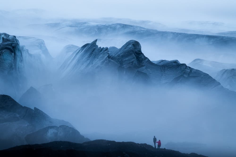 Hikers in Misty Peaks by Valentinos Loucaides — canvas wall art