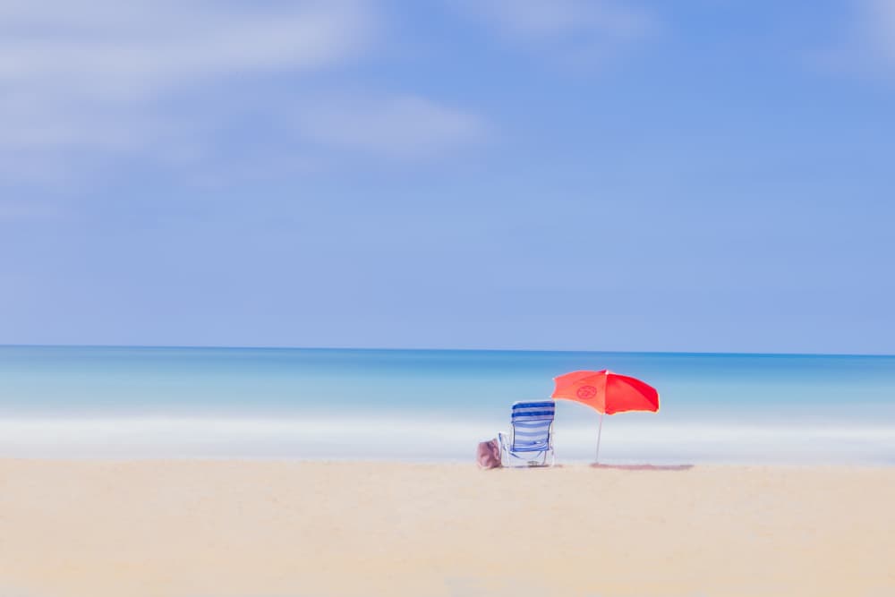 Serene Beach Umbrella by JUAN CARLOS HERVÁS MARTÍNEZ — canvas wall art