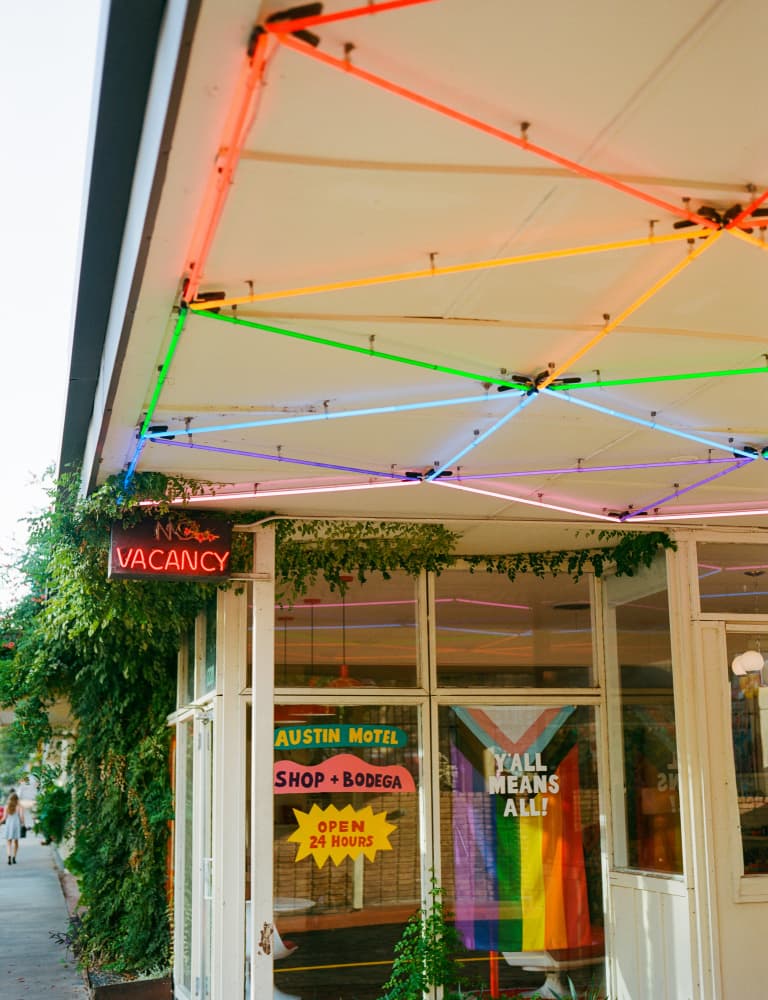 Austin Motel Neon Rainbow by Bethany Young — canvas wall art