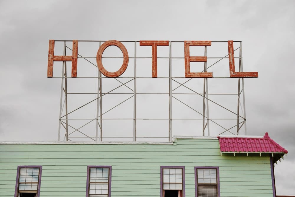 Vintage Hotel Sign by Del Mundo Imagery — canvas wall art