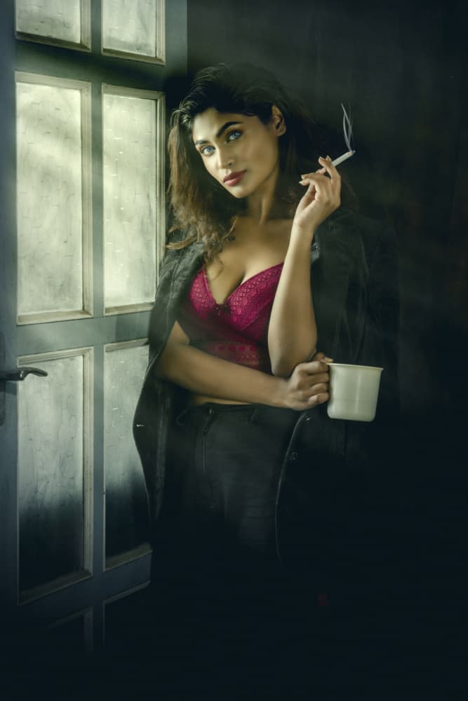 Alluring Woman Smoking Indoors by PARTHA BHATTACHARYYA — canvas wall art
