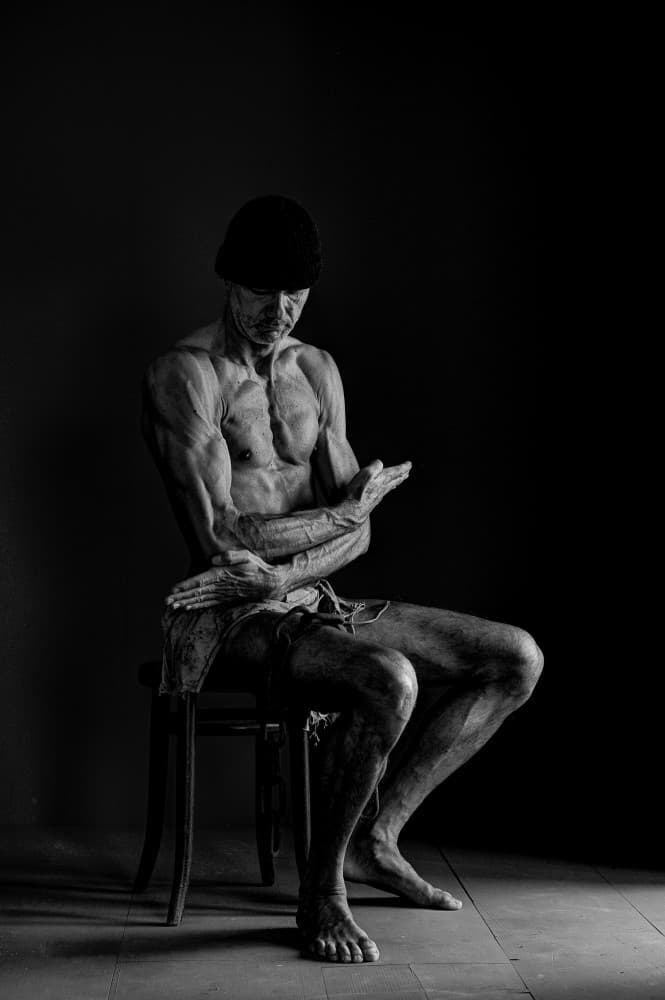 Muscular Man Contemplating by woodplane — canvas wall art