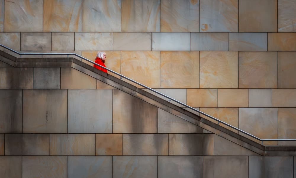 Red Figure on Stairs by Hans Günther — canvas wall art