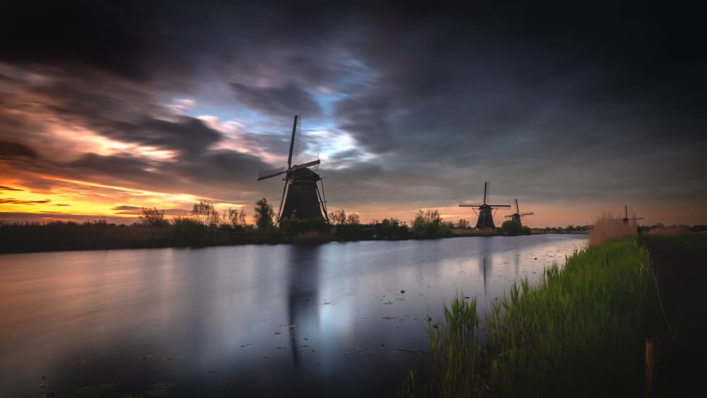 Dutch Windmills Sunset by Gonçalo Capitão — canvas wall art