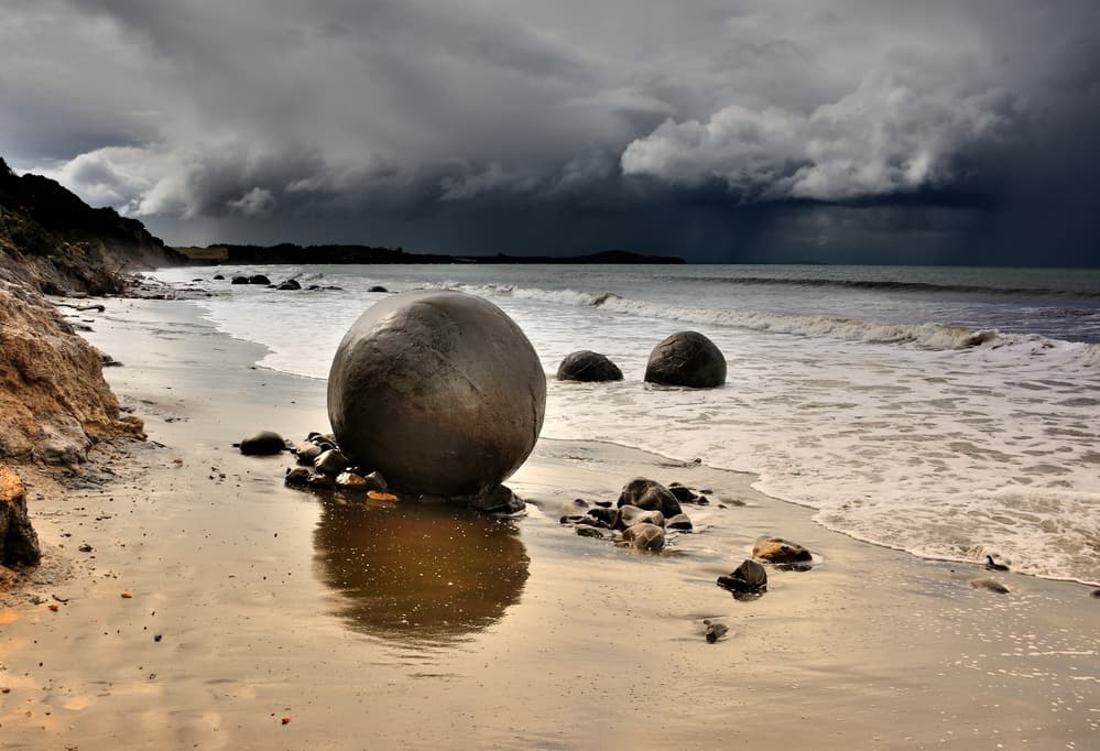 Stormy Beach Boulders by Yair Tzur — canvas wall art