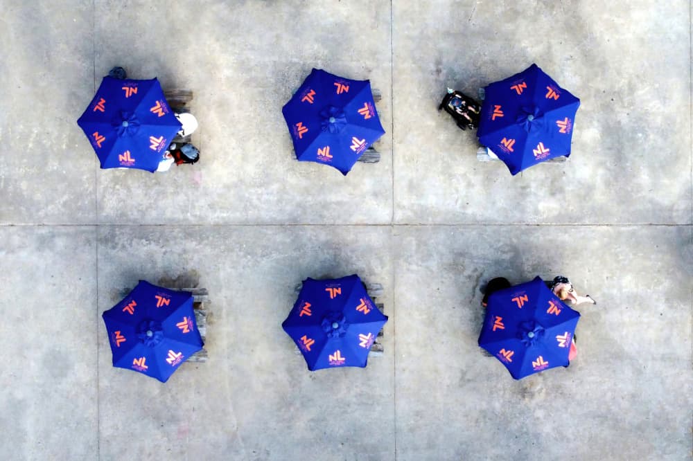 Blue Umbrellas Overhead by Michael Burlak — canvas wall art