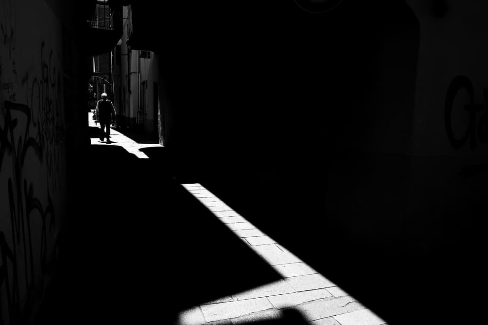 Man in Shadowed Alley by Enrico Finotti Re — canvas wall art