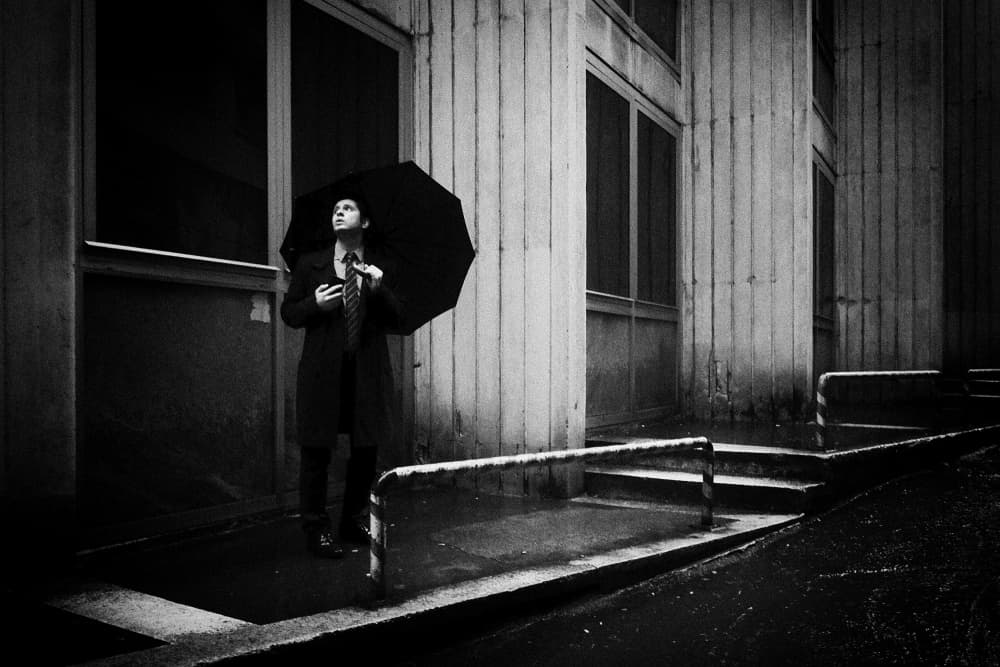 Man In Urban Rain by Alphan YILMAZMADEN — canvas wall art