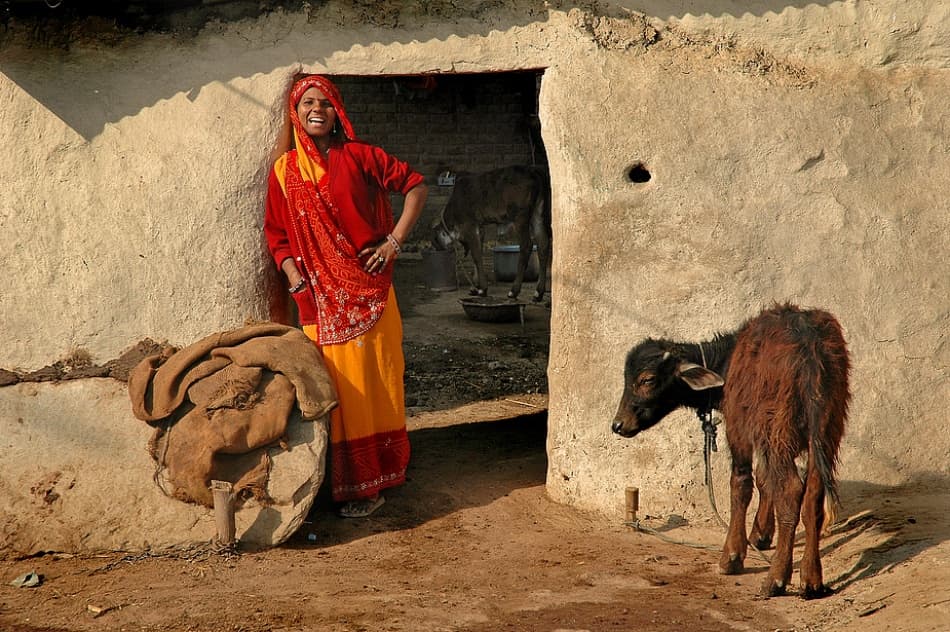 Smiling Woman Village Home by Lou Urlings — canvas wall art